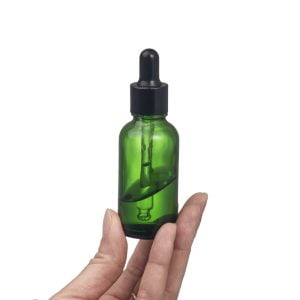 Multi size green essential oil bottle with a dropper